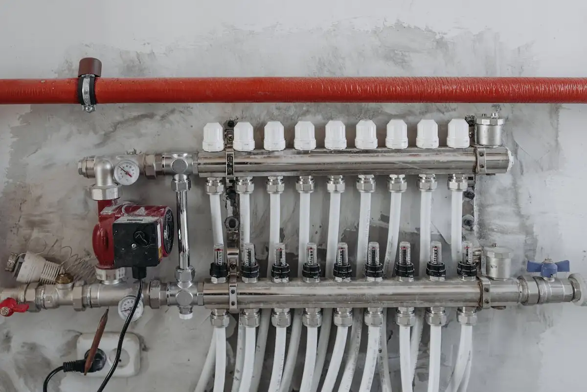 Modern PEX plumbing manifold system installed in a 2026 Bathroom Anatomy layout | EV Constructions